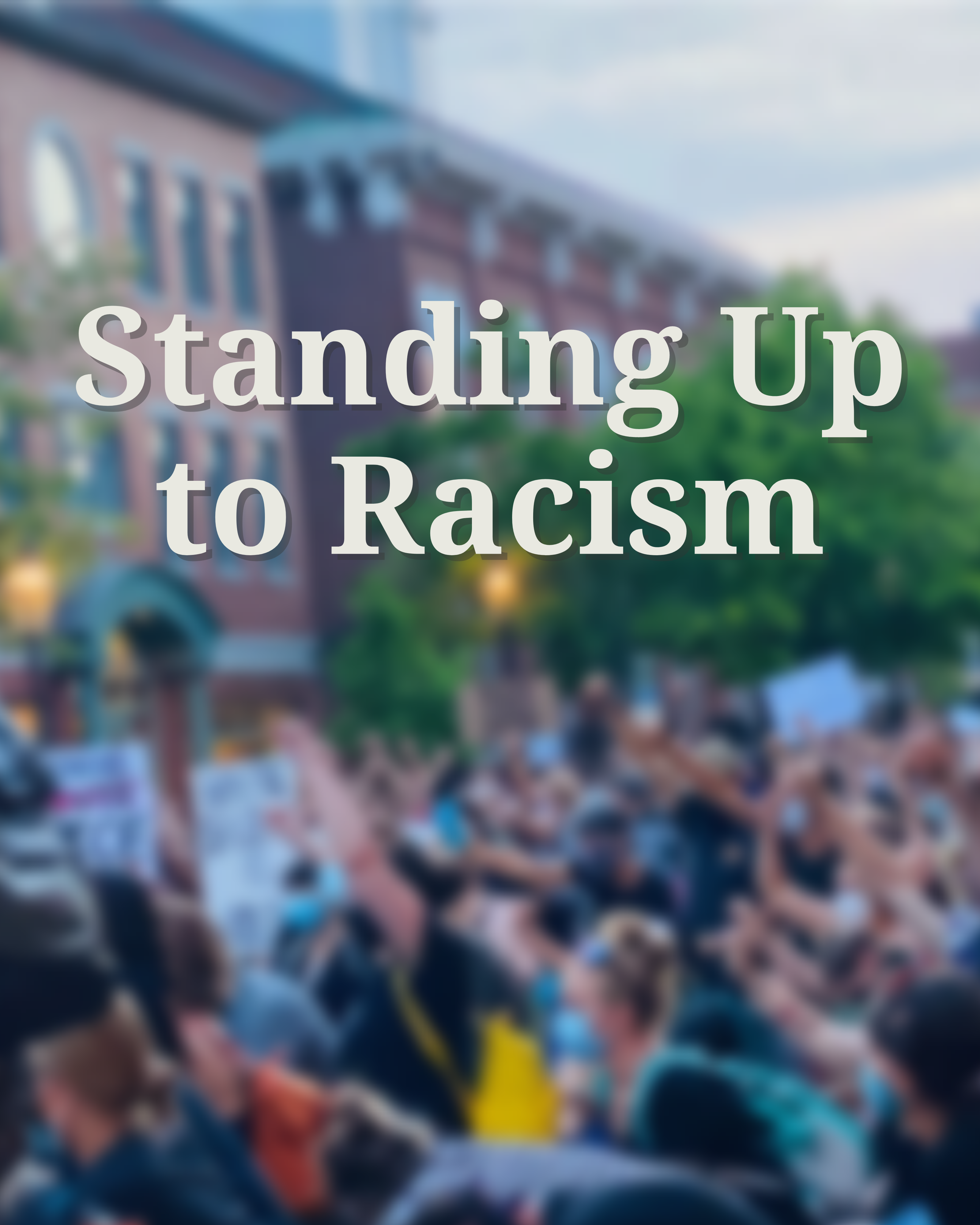 Standing Up to Racism, text over image of protest in downtown Portsmouth