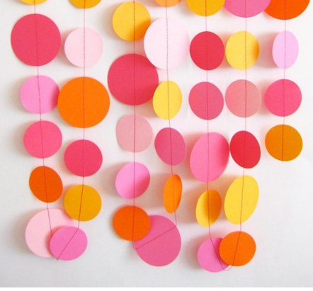 Strands of paper circles in red, orange, pink and yellow
