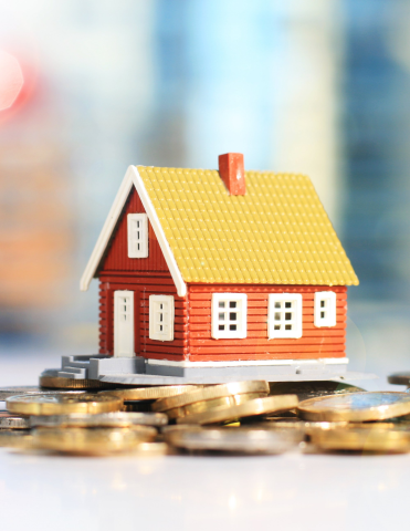 Estate Planning: Image of House on Top of Coins