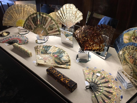 Antique Fans on Display in Glass Case