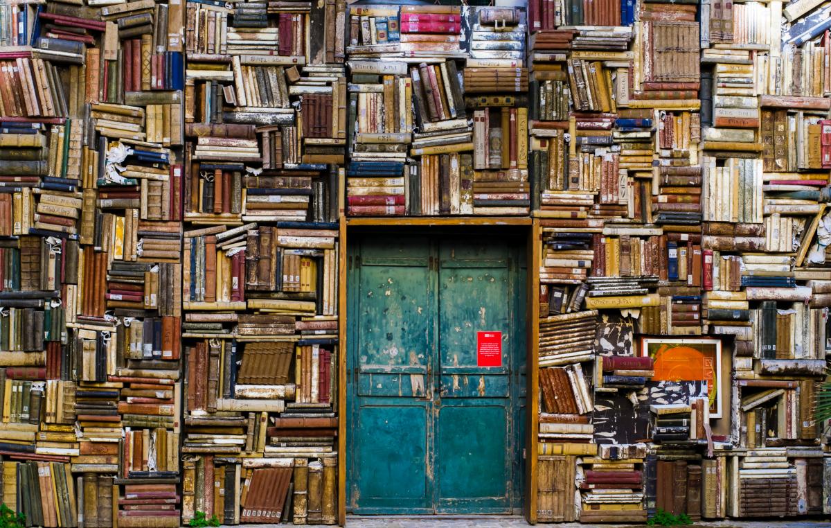 Stacks of Books Surrounding Door