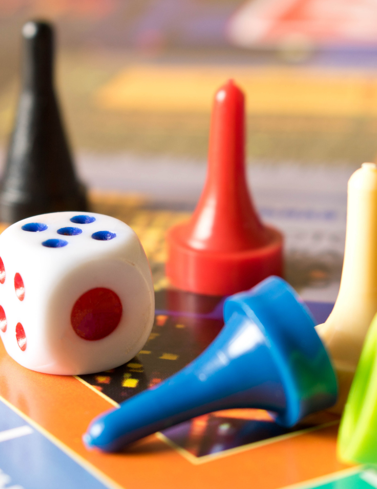 Dice and game pieces on a game board 